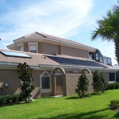 A tile roof application of solar pool heating and solar water he