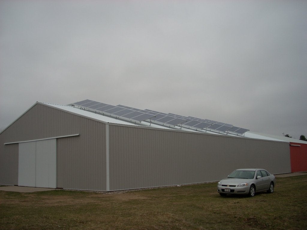 side of of a 20.24kW solar system mounted on a storage business