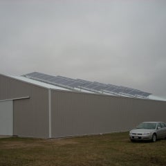 side of of a 20.24kW solar system mounted on a storage business
