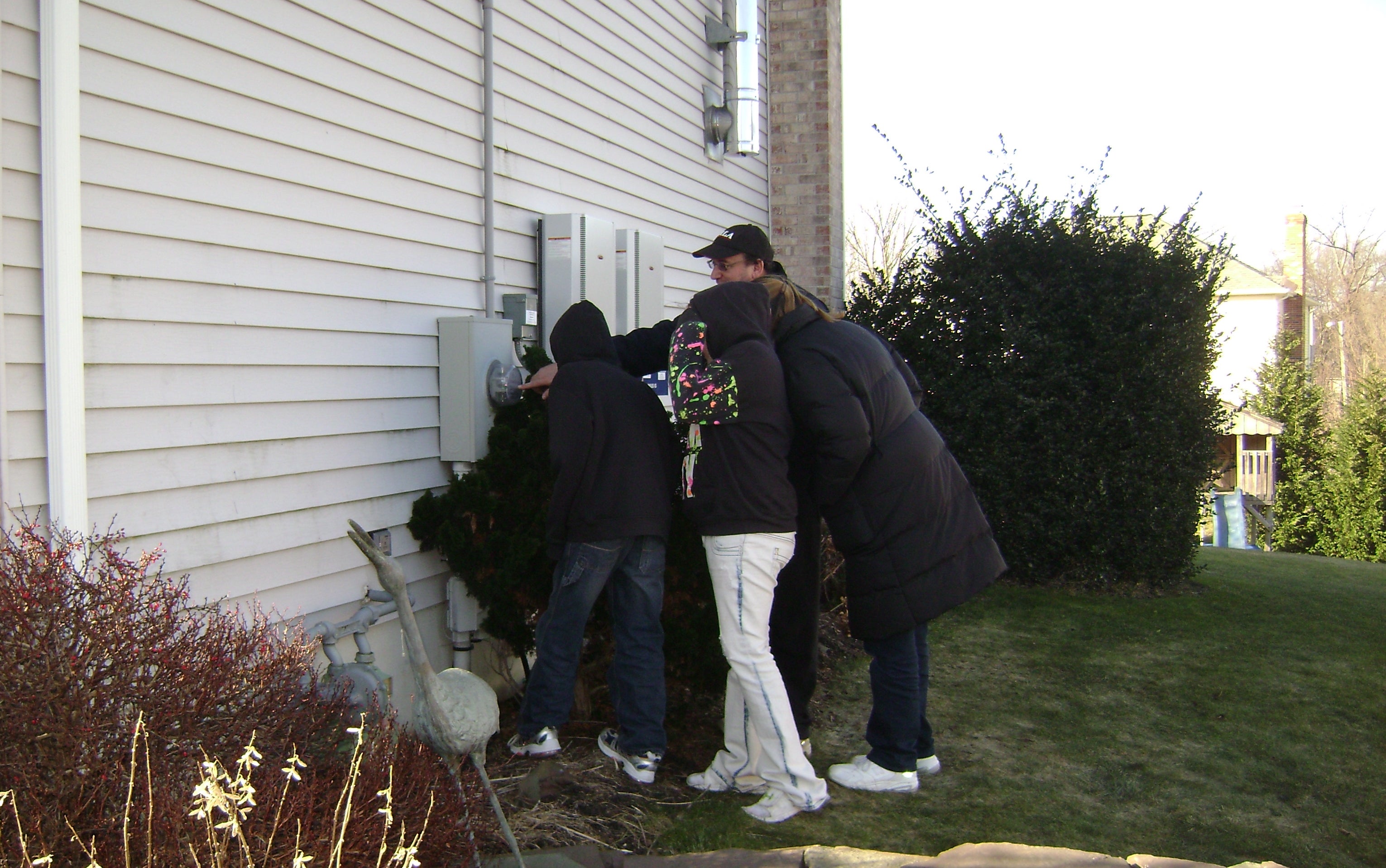 Dad showing the family how solar net metering works.