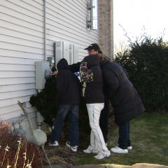 Dad showing the family how solar net metering works.