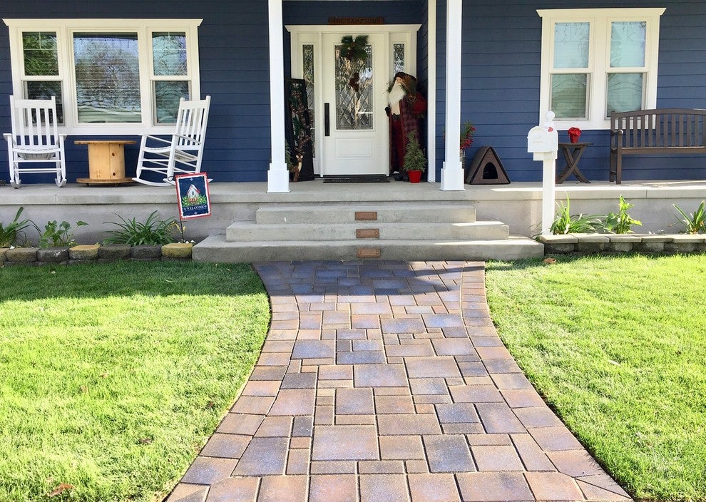 Newly-installed pavers on a front lawn leading up to a residential home
