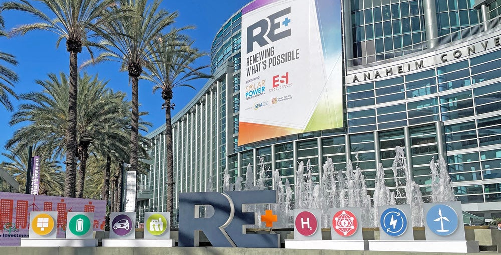 The RE+ 2022 logo and banner at the Anaheim Convention Center