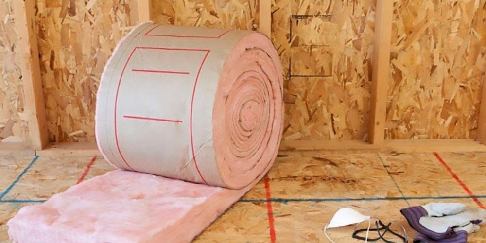 Fiberglass insulation roll in an attic